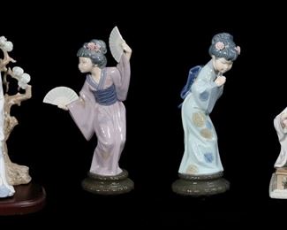 154	6 Lladro Porcelain Figurines Japanese Women	6 Lladro porcelain figurines of Japanese women. Geisha 4807, Japanese Girl Decorating 4840, set of 4 (Girl With Parasol 4988, Sayonara 4989, Chrysanthemum 4990 and Madame Butterfly 4991). Geisha 11 1/2"H, Girl With Parasol 12"H. Sayonara flowers in hair chipped, Girl Decorating repair to flowers in hand.
