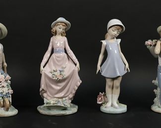 155	4 Lladro Porcelain Figurines	4 Lladro porcelain figurines. Flowers in the Basket, 5027, 9 3/4"H; Candid, 5039, 9 5/8"H; Wheelbarrow With Flowers, 1283, 9 1/4"H; Flowers on the Back, 1286, 9 1/4"H. Flowers in the Basket repair and chip to flowers on front of dress, one flower detached and chipped; Candid rose petals cracked and loose, Flowers on the Back chips to one flower petal in basket.
