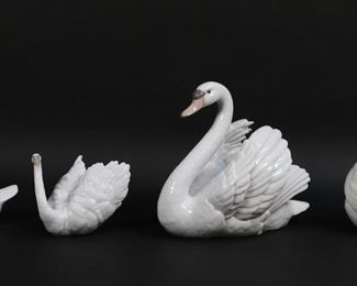 156	5 Lladro Porcelain Swan & Duck Figurines	5 Lladro porcelain swan and duck figurines. Graceful Swan, 5230, 8 1/2"H; Swan With Wings Spread, 5231, 7 1/8"H; White Swan, 6175, 4"H; Swan, 4829, 5 3/4"H; Little Duck, 4553, 4 1/8"H. All with blue Lladro marks to the undersides.
