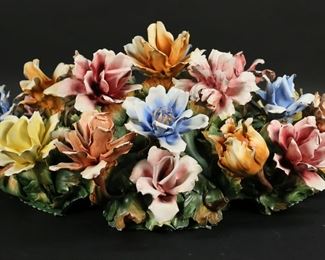 165	Capodimonte Porcelain Floral Centerpiece	Capodimonte hand painted Italian porcelain flower centerpiece. Signed on the underside with crown over N mark. 20 1/2"L x 14 3/4"W x 10"H. As is, with chips throughout.
