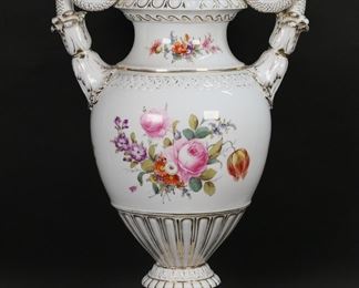 167	Carl Teichert Meissen Porcelain Urn	Meissen Oven & Porcelain Company (Carl Teichert) porcelain lidded urn / vase. Figural serpent handles, hand painted floral and gilt decoration. Blue Meissen in oval with star below Carl Teichert mark to the underside. 23"H to top of finial on lid. Losses to gilt decoration to lid and throughout.

