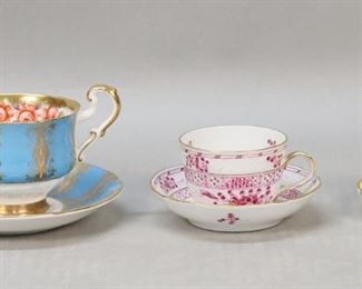 171	5 Porcelain Cups & Saucers Versace, Herend	5 porcelain cups and saucers. Versace for Rosenthal Medusa, 2 hand painted Limoges demitasse, Paragon bone china, Herend demitasse. Medusa cup 3 5/8"H, saucer 5 3/4"-diameter. Herend cup line to base and repairs throughout body.
