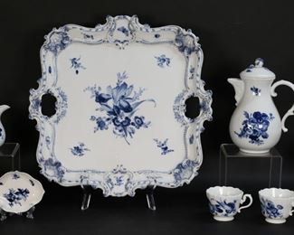 173	10 Piece Meissen Blue Flowers Porcelain Demitasse	10 piece Meissen Blue Flowers porcelain demitasse set. Tray, chocolate pot, creamer, dish, 3 demitasse cups and saucers. All with blue crossed swords marks. Tray 16 1/8"L, chocolate pot 8"H. Chips to flower finial on lid of chocolate pot and chip to underside of lid, chips to base of creamer, chip to underside of one saucer.
