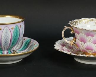 178	2 Porcelain Cups & Saucers Including Meissen	2 porcelain cups and saucers. Meissen cup and saucer, relief shell motif in pink, with gilt decoration, blue crossed swords marks to the undersides, cup 2 1/2"H, saucer 6"-diameter; cup and saucer with leaf motif and gilt decoration, illegible marks to the underside, possibly Furstenberg, cup 2 3/4"H, saucer 5 1/2"-diameter. Meissen losses to gilt decoration on cup and saucer, two vertical lines from rim into body of cup; leaf saucer losses to gilt decoration at center and to enamel beads, flake to the rim of cup, firing crack to underside of cup.
