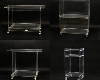 183	Four Mid Century Modern Acrylic or Lucite Stands	"Four  Mid Century Modern acrylic or Lucite stands. 20th century. Three rolling stands all on casters. No apparent brand labels or maker's marks found. Scuffs, scratches and wear throughout all pieces. Tarnishing and wear to metal on casters. Tallest stand has remnants of shrink wrap on casters. Remnants of tape on base on shortest stand. 

Tallest stand: 24"" W x 13"" D x 21"" H. Widest stand is 27"" W. 90 lbs total. 

"

