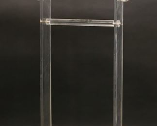 186	Mid Century Modern Acrylic Valet Stand By Akko	"Mid Century Modern acrylic valet stand produced by Akko. Lawrence, MA, 20th century. Akko label on one side of base. Light scuffs and wear throughout. 

17 1/2"" W x 9 1/2"" D x 43 1/2"" H. 11 lbs."
