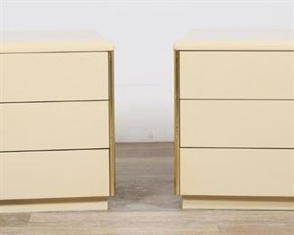 190	Pair of Charak Modern Style Nightstands	"Pair of Mid Century Modern nightstands in the style of Charak Modern. 20th century Pressboard, laminate, and brass drawer pulls. No apparent maker's marks or labels. Light scuffs and wear throughout finish of each nightstand. Staining to laminate on left and right sides of one nightstand. Light marks to drawers on each nightstand. 

27 3/4"" W x 17 1/2"" D x 17"" H. Each nightstand weighs 49 lbs."
