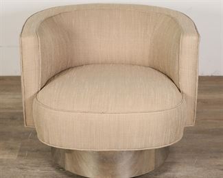 189	Mid Century Modern Baughman Style Lounge Chair	"Mid Century Modern lounge chair in the style of Milo Baughman (Goodland, KS, 1923-2003). 20th century. Tan upholstery club-form chair on round chrome base set on four casters. No apparent maker's marks or labels found. Pilling and wear to upholstery. Scuffs, scratches and tarnishing to chrome on base. Large cut-out hole on underside on base of chair. 

28 1/2"" W x 30"" D x 25 1/2"" H. 76 lbs."
