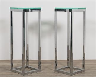 195	Pair of Modernist Chrome & Glass Pedestal Tables	"Pair of Modernist chrome and glass pedestal tables. 20th century. Beveled square glass tops on chrome bases. Slight tarnishing, wear and scuffs to chrome of both tables. Light scratches, scuffs and wear to glass tops.

12"" W x 12"" D x 34 3/4"" H (with glass)"
