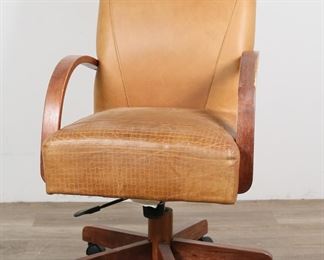 198	Shermag Inc. Mid Century Style Office Chair	"Mid Century Modern style office chair by Shermag Inc. Canadian, 21st century. Toffee-colored faux leather chair on plastic casters. Shermag labels on underside of chair. Shermag tag on base of chair. Wrinkling, fading, and wear to upholstery. Scratches, wear and losses to wood on arms of chair. 

25 1/2"" W x 28 1/4"" D x 40"" H. 39 lbs."
