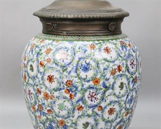 233	Chinese Porcelain & Bronze Ginger Jar	Chinese porcelain ginger or temple jar, with bronze lid. Crackle glaze, polychrome flower and vine decoration. Unmarked. 16 1/4"H.

