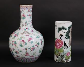 237	2 Chinese Porcelain Vases	2 Chinese porcelain vases. Cylindrical vase with hand painted crane and flowers, red four character mark to the underside, 11 3/8"H; bottle form vase with hand painted flowers, birds and insects, marked China, 16"H. Bottle form vase drilled.
