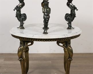 248	Regence Style Figural Marble Top Tier Table	"French Regence style marble top tier occasional table in the style of Maison Jansen. 20th century. Marble top and lower tier, brass figural siren or mermaid caryatid-form supports, brass legs. Marble top lifts off. Light staining and wear to marble. Small chips to marble on edge of lower tier. Tarnishing and wear to brass on supports, legs, and rope-form edge of table. Repairs to metal on one leg of table. 

29"" H x approximately 22 3/8"" diameter of lower tier. 73 lbs."
