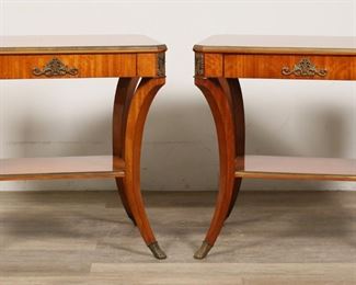 250	Pair of Empire Style Side Tables by Widdicomb	"Pair of French Empire side tables by the John Widdicomb Company. American, circa 1990. Walnut tables each with lower tiers, fitted with brass mounts and paw feet caps. Metal Widdicomb labels on inside of drawer on each table. Light scratches and wear to tops of tables. Scuffs and marks to wood on lower tier of one table. 

28"" W x 20"" D x 26 3/4"" H. Each table weighs 35 lbs."
