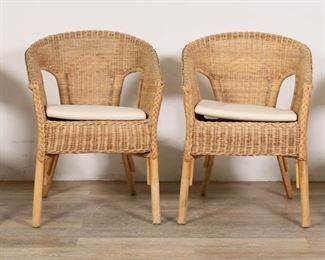 262	Four Mid Century Style Ikea Agen Armchairs	"Four wicker and rattan ""AGEN"" armchairs produced by Ikea. 21st century. No apparent brand marks or labels present. Marks and scuffs to rattan of legs on all chairs. Small separations to wicker on backs and arms of chairs. Staining and wear to seat cushions. Small white stain on left arm of one chair.

22 1/2"" W x 23"" D x 30 5/8"" H. Seat height 19"" H (with cushions). Arm height of 24"" (at lowest point).  Each chair weighs 10 lbs."
