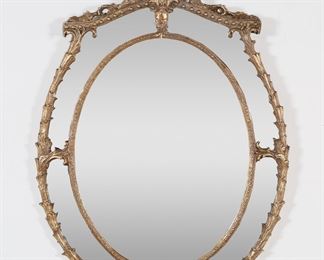 265	Louis XV Style Mirror	"Louis XV style mirror 20th century. Mirror with gilded composite inner and outer frame. Scuffs and wear to mirrored surface. 

33 3/4"" x 22 3/4"". 15 lbs."
