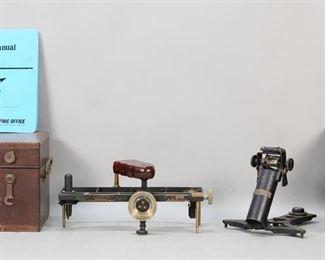 288	Kelvin Azimuth Mirror & Schick US Navy Stadimeter	2 nautical navigation tools. Kelvin & Wilfrid O. White Co. Kelvin Azimuth Mirror; Schick Incorporated U.S. Navy Bu. Ships Stadimeter 1943. Both in wooden cases. With a U.S. Naval Oceanographic Office Maneuvering Board Manual. Scratches, chips and minor losses to both cases, wear and fraying to leather strap on azimuth meter case and lid warped; Azimuth mirror some rusting and paint chips; Stadimeter scratches to wood, some corrosion and oxidation; manual some discoloration to covers and pages.
