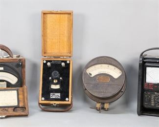 289	Grouping of Four Electrical Instruments	"Grouping of four early 20th century electrical instruments. Weston D.C. Voltmeter Model 45 in oak fitted case. Shallcross No. 310 portable galvanometer in oak fitted case. Weston cast iron voltmeter gauge. Simpson multimeter with carrying handle. All untested. All as is, with wear, scratches, losses, scuffs, and dirt throughout cases and metal of instruments. 

Simpson multimeter: 6 3/8"" W x 4 3/4"" D x 10 1/2"" H."
