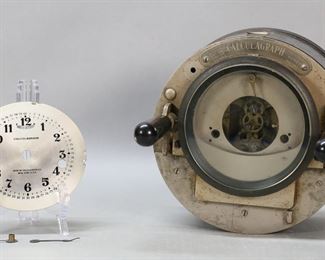 290	Calculagraph Elapsed Time Computer	Calculagraph elapsed time computer. In original box. Face and hands detached (pieces present). Calculagraph untested. Scratches, corrosion and rusting throughout. Scratches to face. Wear and tears to box. 8 1/2"-diameter.

