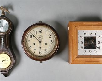 292	3 Wall Clocks Seth Thomas, Gilbert, Bulle	3 wall clocks. Gilbert figure 8 eight day clock with thermometer and Lufft German barometer, 18 3/4"H; Seth Thomas circular wall clock with paint decorated face, 10 1/4"-diameter; Bulle French electric clock, face marked Gold-Lebey Levallois, 10 1/4" x 10 1/4". All untested. All with scratches, chips and losses to cases. Gilbert clock eagle finial missing wing; Seth Thomas scratches and losses to face, wear to brass patina, losses to paint decoration on case, hinges resoldered.
