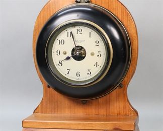 295	Bulle Model G Electric Clock	Bulle Model G French electric battery powered shelf / mantel clock. Untested. 11 3/4"W  x 15 3/4"H. Scratches to wooden base below clock, apparent repainting to clock case.
