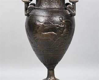 310	Greek Style Bronze Vase	Reproduction bronze krater / urn, with Greek motifs including chariot riders. On marble base. 19"H including base and handles. Chip to one corner of marble base.
