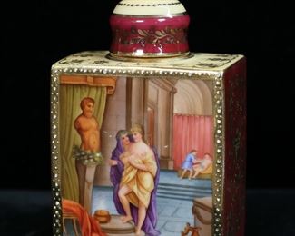 314	Royal Vienna Style Porcelain Bottle	Vienna style porcelain lidded bottle. Hand painted scenes with gilt decoration. Illegible inscription and blue "beehive" shield mark to the underside. 4 3/4"H. Losses to gilt decoration on finial of lid, around collar and neck, and to edges.
