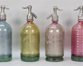 331	4 Vintage Colored Glass Seltzer Bottles Argentina	4 vintage colored glass seltzer bottles / soda siphons from Argentina. Pink textured Lourdes bottle, F Benitez y Cia pink bottle with etched lettering, Rodriguez y Roman amber bottle, Ernst y Heinisch blue bottle with etched lettering. Lourdes bottle 12"H. All with losses to metal tops and collars, chips and flakes throughout Lourdes bottle, loss of color and internal crack to Benitez, loss of color to Rodriguez and Ernst bottles, collars splitting.
