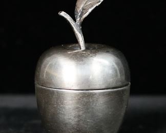 370	Tiffany & Co. Makers Sterling Apple Box	Tiffany & Co. Makers sterling silver apple form lidded trinket / pill box. Marked on the underside Tiffany & Co. Makers Sterling 25008. 2 1/4"H. 28.71 grams.
