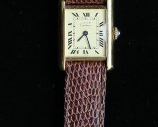 376	Must de Cartier Women's Vermeil Quartz Tank Watch	Sterling, lemon dial and  leather band. Runs but may not keep time.
