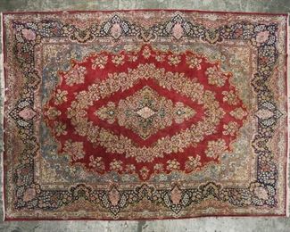 381	Room Size Persian Rug	Room size Persian rug. Red ground, floral motifs.13'5" x 9'10". Wear to edges, fringe missing, hole near center medallion, staining and discoloration, small indentations.
