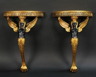 385	Pair of Wood & Composition Isis Figural Brackets	Pair of giltwood and composition figural brackets / shelves. Egyptian motif, with winged Isis supporting a gilt painted shelf. Each 12 3/4"L x 8 3/8"W x 3 5/8"D.
