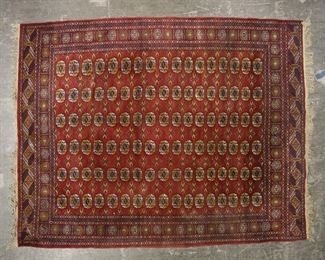 384	Room Size Bokhara Style Rug	"Bokhara style rug. 20th century. Repeating polychromatic medallions against red and blue field. Fraying, losses, and dirt to fringe. Losses to threading on edges and border of rug. Staining to rug near one corner of medallion field. Fading and wear throughout rug. Slight warping to rug.

8"" 1"" x 10' 5"""
