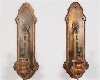 390	Pair of Hardwood and Copper Sconces	"Two Italian made hardwood sconces with copper hardware. Measure 8 1/2"" W x 11"" D x 24 3/4"" H. The copper is somewhat corroded, much of the wood finish has worn off and it is subject to cracking, and many of the screws securing the fixtures are missing.

From the collection of a prominent Connecticut family."
