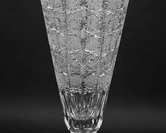 410	Continental Cut Crystal Vase	Continental cut crystal vase with hobstars. 16 1/2"H. Chips and fleabites to rim, chips to all four corners of base.
