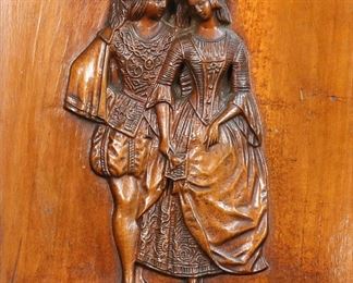 416	Black Forest Carved Wood Plaque Couple	Black Forest style carved wooden plaque of a couple. 10 3/4" x 8 5/8" (with frame 14 3/8" x 12 1/4"). Plaque loose in frame, minor chips and losses to frame.
