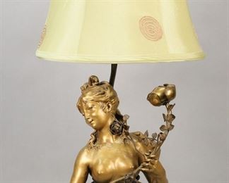 425	Gilt Bronze Lamp Nude Bust of a Woman	Gilt bronze lamp, nude bust of a woman with roses. On a wooden column base. 27 1/2"H including finial. Scratches and losses to gilt patina.
