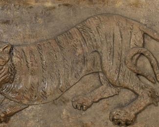 426	Composition Relief Wall Sculpture Tiger	Composition wall plaque of a tiger in relief. 24 3/4" x 56 1/2". Chip lower right, chip and repair lower right, crack near tiger's tail, chip upper right corner, repair below tiger's rear paw, repair lower left corner, minor chips and roughness along edges and corners.
