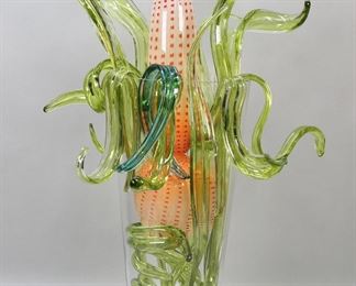 427	Dale Chihuly Style Art Glass Sculpture	Art glass sculpture in the style of Dale Chihuly. Unsigned. Made up of approximately 20 separate pieces. In a glass vase. Vase 17 3/4"H, sculpture 26 3/4"H (as photographed). Chip to rim of vase.
