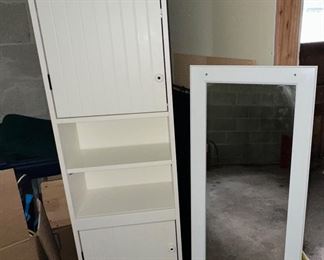Tall white storage cabinet and wall mirror from IKEA 