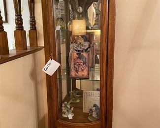 a pair of matching curio cabinets