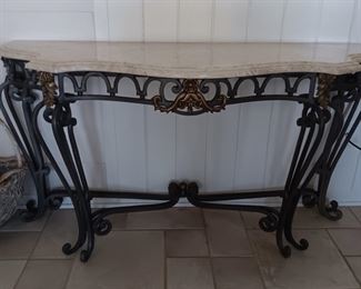 Iron and marble/granite top table. Good for entry, behind sofa or anywhere else you need a great piece!
