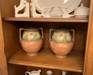 Roseville Pottery urns along with various Lenox pieces