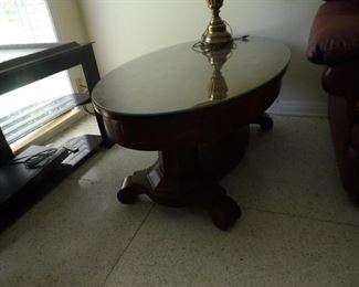 Oval wooden coffee table with glass top
