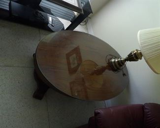 Oval wooden coffee table with glass top