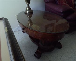 Oval wooden coffee table with glass top