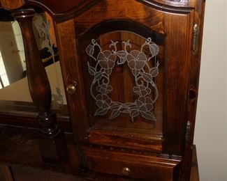 Ornate wooden headboard with storage