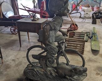 Bronze Yard/Garden Statue of a Life Size Boy on a Bicycle. Originally Sculpted By: Max Turner
