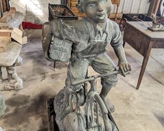 Bronze Yard/Garden Statue of a Life Size Boy on a Bicycle. Originally Sculpted By: Max Turner