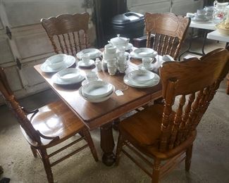 Jacobean style oak table with 4 pressed back oak chairs (multiple leaves not pictured)